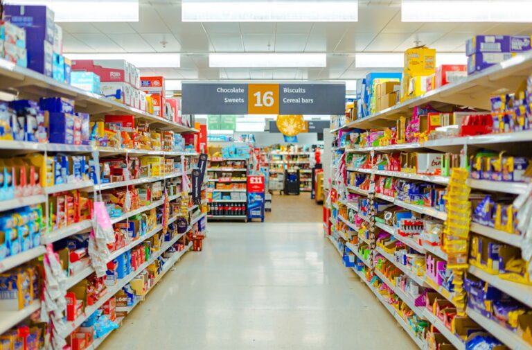 a grocery store aisle filled with lots of food